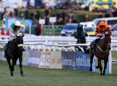 Many Clouds ridden by Leighton Aspell (left) wins the BetBright Trial Cotswold Chase ahead of Thistlecrack ridden by Tom Scudamore.