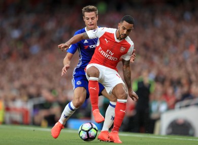 Chelsea's Cesar Azpilicueta (left) and Arsenal's Theo Walcott battle for the ball in the match between the two sides earlier this season.