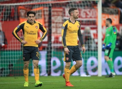 Arsenal's Shkodran Mustafi (right) and Arsenal's Hector Bellerin (left) appear dejected after Bayern Munich's Robert Lewandoski (not in picture) scores his side's second goal of the game.