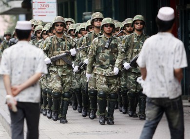 File photo of police in Xinjiang province.