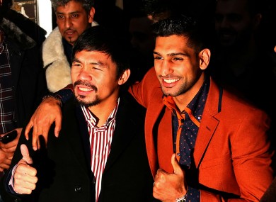 Manny Pacquiao and Amir Khan pose as they negotiate a potential welterweight bout