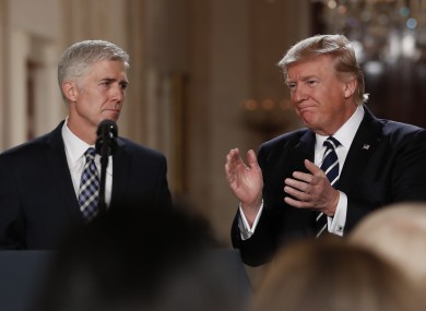 Trump applauds new Supreme Court judge Neil Gorsuch in the White House yesterday.