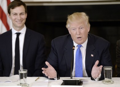 Donald Trump speaks as Jared Kushner his senior adviser looks on.