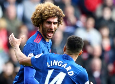 Marouane Fellaini celebrates with Jesse Lingard.