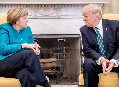 German chancellor Angela Merkel sits next to US president Donald Trump before their meeting in the oval office in Washington on Friday.