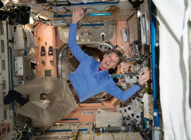 American astronaut Peggy Whitson celebrates after smashing the record for the most cumulative time in space by an American astronaut aboard the International Space Station.