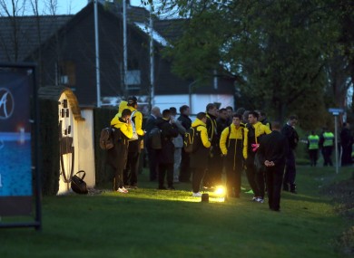 The Dortmund players waiting around after last night's incident.