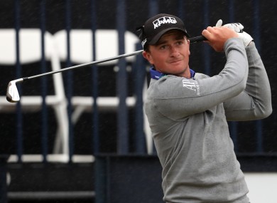 Paul Dunne is dealing well with difficult conditions in China.