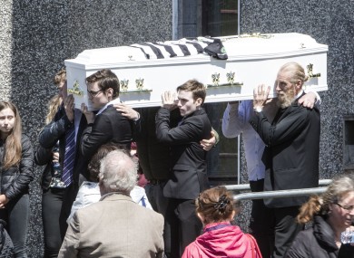 Conor’s coffin carried by his friends and his father Greg (right).
