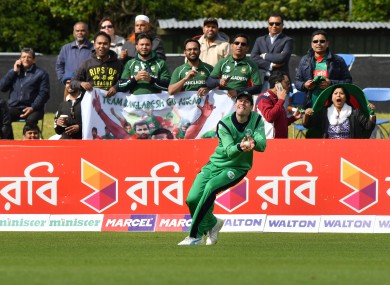 George Dockrell takes a boundary catch to dismiss Sabbir Rahman