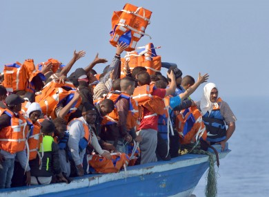 File image: Migrants stranded on a boat off the Libyan coast in 2015.