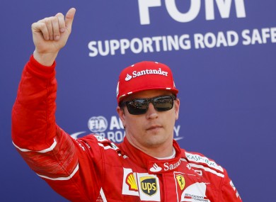Ferrari driver Kimi Raikkonen of Finland greets the crowd.