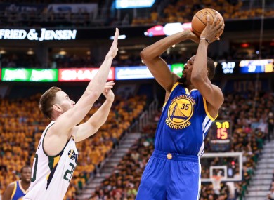 Golden State Warriors forward Kevin Durant (35) shoots the ball over Utah Jazz forward Gordon Hayward (20) during the second quarter in game three.