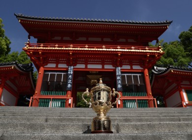 The Webb Ellis Cup stands on the steps of the Yasaka Shrine in Kyoto.