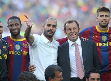 Rosell poses with Pep Guardiola ahead of a pre-season fixture in 2010.