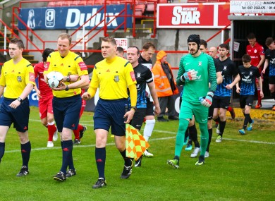 The Athlone players walk out alongside Shelbourne at Tolka Park earlier this season.