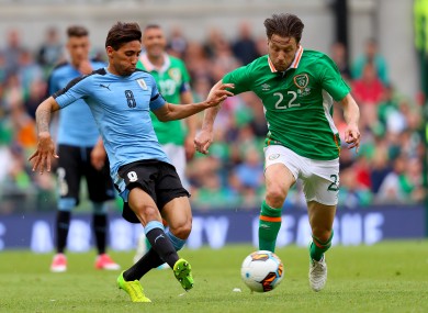 Arter with Uruguay's Jonathan Urretaviscaya.