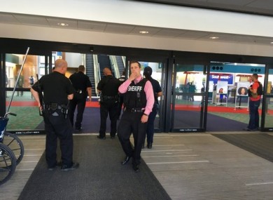 Officers gather at the terminal in Bishop International Airport.