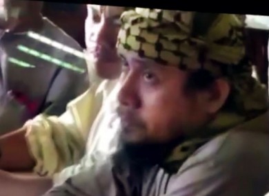 The purported leader of the Islamic State group's Southeast Asia branch, Isnilon Hapilon, at a meeting of militants at an undisclosed location.