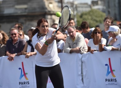 Marion Bartoli playing tennis on the Alexander III bridge near the Invalides in Paris on 24 June, 2017 in a bid to promote the candidacy of the city of Paris for the Summer Olympics Games in 2024.