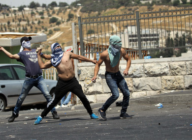 Palestinians clash with Israeli police in East Jerusalem.