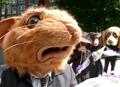 Members of the anti-animal experimentation group BUAV stage a mock funeral outside the Home Office in London, 2006.
