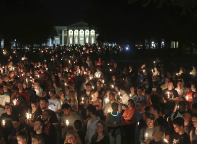 Students, teaching staff and Charlottesville residents led a candlelit march across the campus of the University of Virginia.
