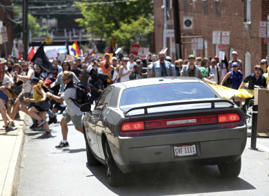A vehicle plows into a group of protesters marching along 4th Street NE at the Downtown Mall in Charlottesville on the day of the Unite the Right rally.