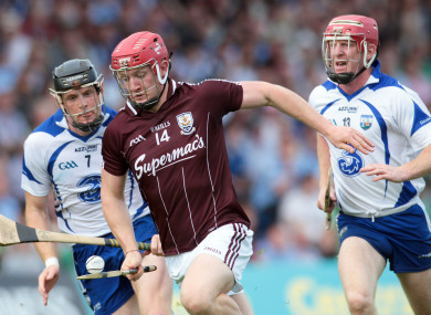Waterford's Kevin Moran (left) and John Mullane chase Galway's Joe Canning in 2011.
