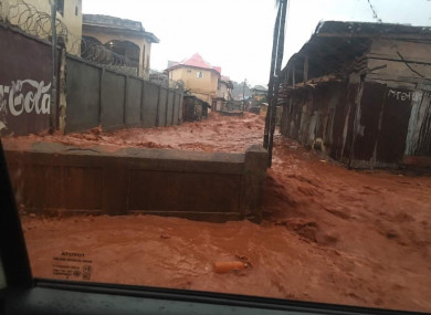 Mud and water burst through the streets of Freetown, Sierra Leone.