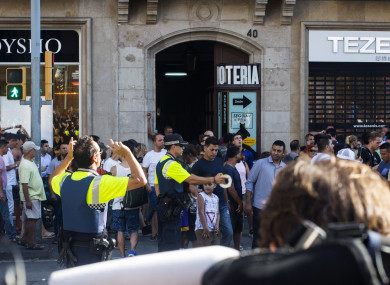 Police officers block a street in Barcelona.