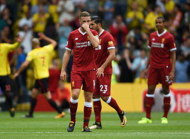 Liverpool captain Jordan Henderson looks dejected.