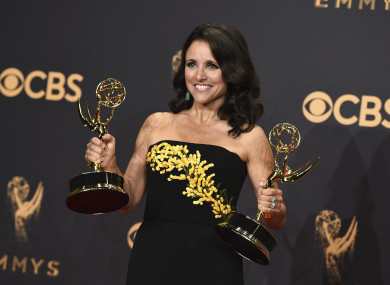 Julia Louis-Dreyfus poses in the press room with her awards at the Emmys on 17 September.