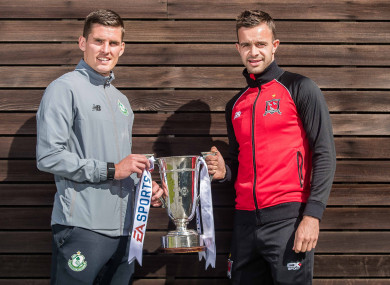 McAllister and Dundalk's Robbie Benson with the EA Sports Cup trophy.