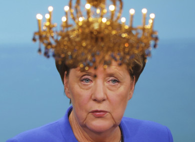 A well-placed chandelier in front of a TV screen showing last night's debate between Angela Merkel and her rival Martin Schulz