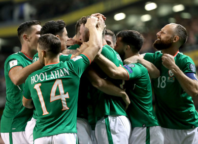 The Irish players mob goalscorer Murphy.
