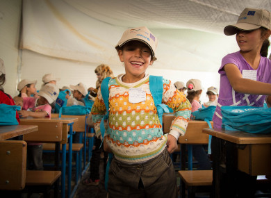 A Syrian refugee girl attending school during 2013's International Day of the Girl