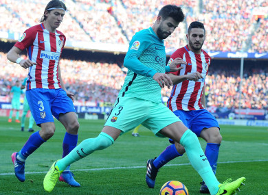 Atletico Madrid pair Filipe Luis and Koke with Gerard Pique of Barcelona