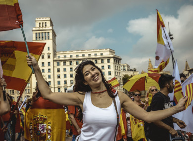 Anti-separatist Catalans shout slogans as they gather at Barcelona's Placa de Catalunya.