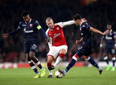 Arsenal's Jack Wilshere (right) with Red Star Belgrade's Mitchell Donald (left) and Slavoljub Srnic.