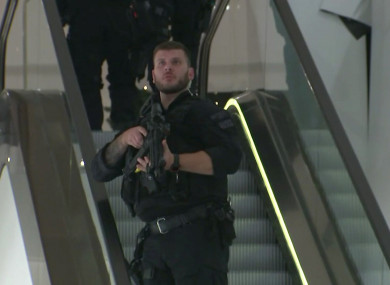 In this grab taken from video, an armed police officer patrols in Selfridges.