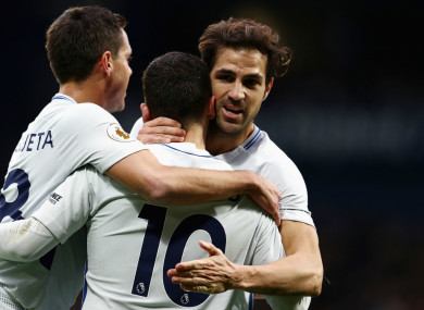 Eden Hazard (centre) celebrates with Cesar Azpilicueta (left) and Cesc Fabregas