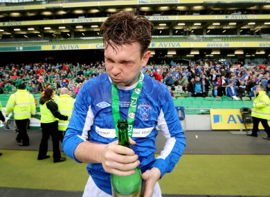 Liffey Wanderers' Glen O'Connor celebrates winning the Junior Cup.