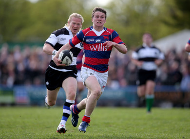 Max McFarland makes a break for Clontarf.