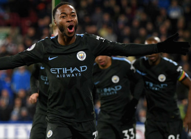 Raheem Sterling celebrates Manchester City's winner against Huddersfield Town.
