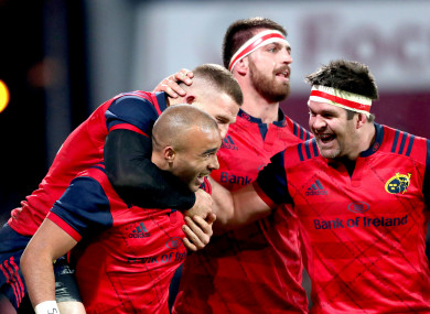 Munster celebrate Zebo's try.