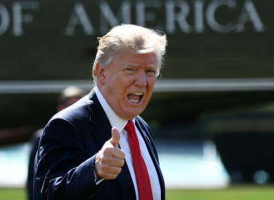 Trump walks towards the Oval Office after returning to the White House.