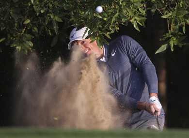 McIlroy plays out of the sand this morning.