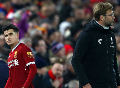 Philippe Coutinho and Jurgen Klopp.