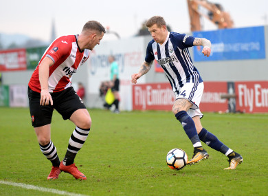 McClean (pictured here alongside Exeter City's Pierce Sweeney) has been with the Baggies since 2015.